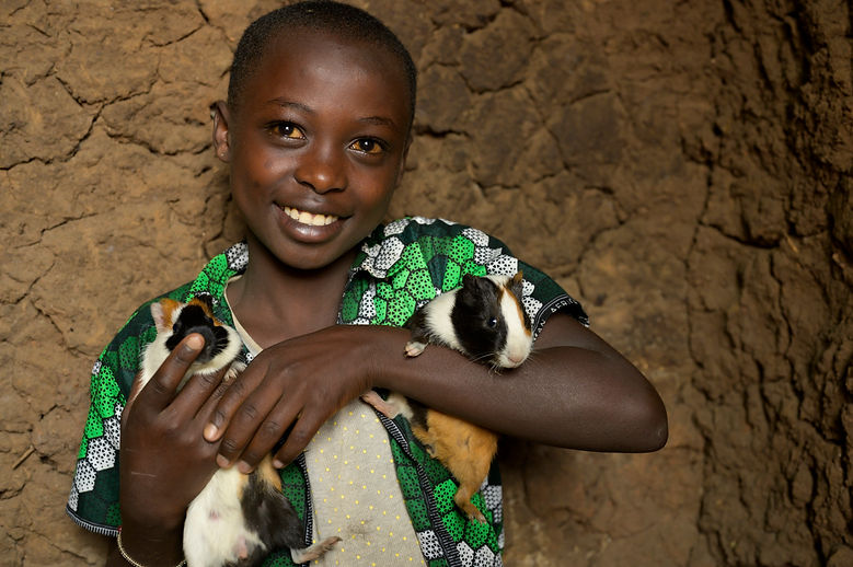 Young girl holding rabbits