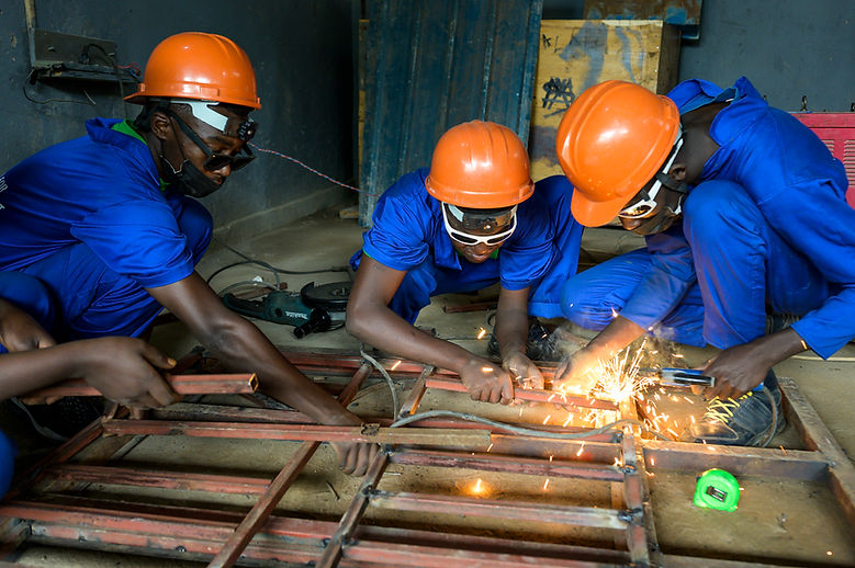 Students working on a window frame